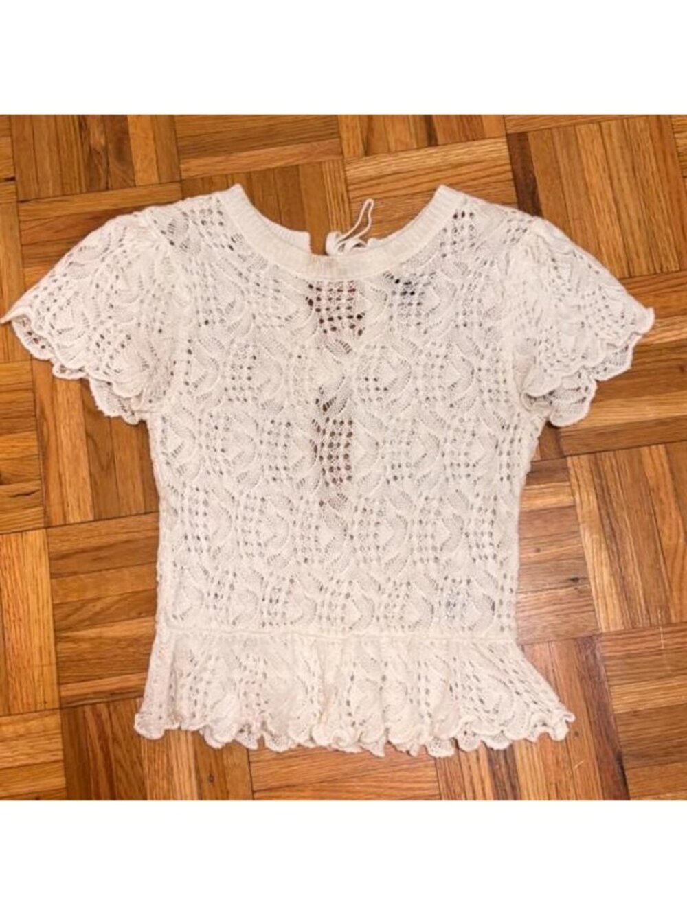 H&M white lace top with tie detail. Slight discoloration on collar. Size: XS